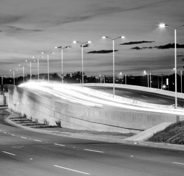 Empty bridge, towers and street lights at night in Guadalajara, Mexico, freeway.