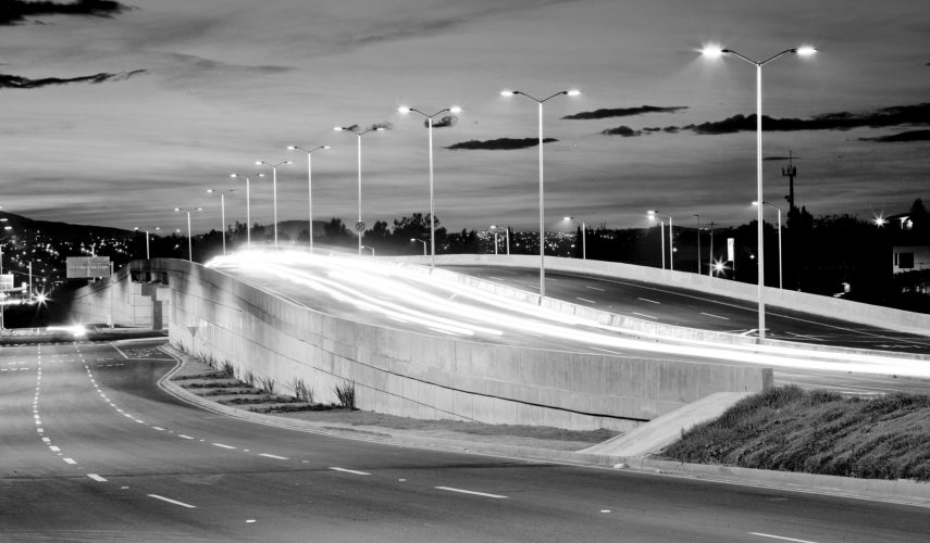 Empty bridge, towers and street lights at night in Guadalajara, Mexico, freeway.